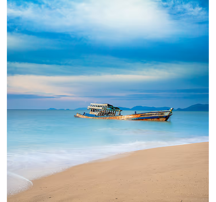 Blue wall mural with boat on the beach - TenStickers