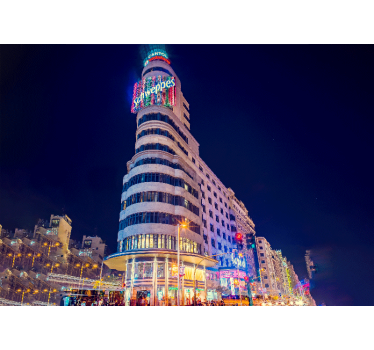 Gran Vía from the ground in the evening city wall mural - TenStickers
