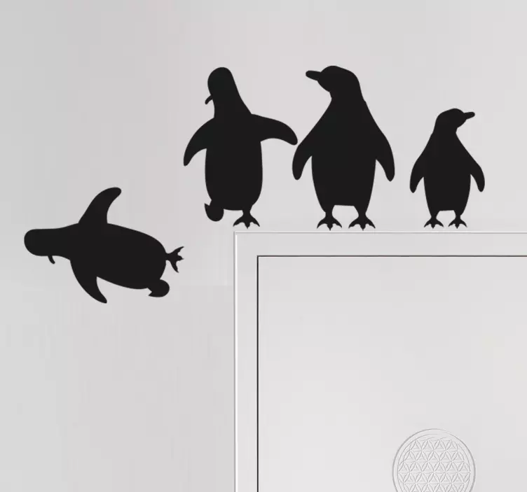 Silhouetted penguins jumping door sticker - TenStickers