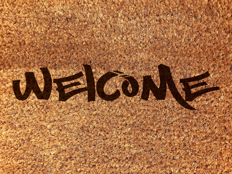 Welcome mat graffiti text entrance hall tiles - TenStickers